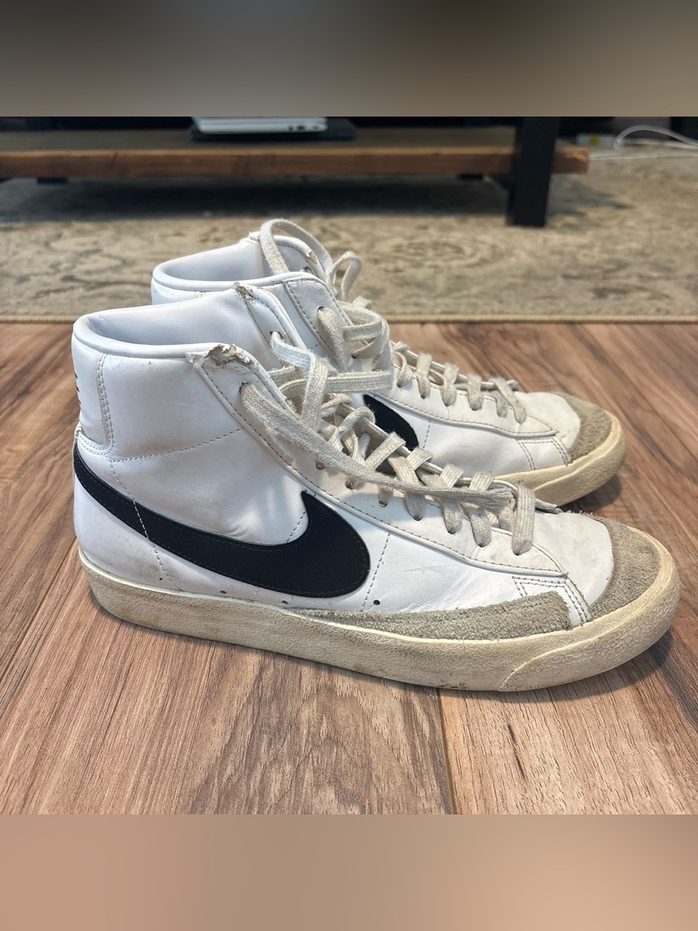 Nike White High-Top Sneakers with Black Swoosh